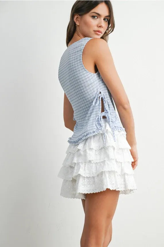 A light blue and white striped sleeveless checkered ladder lace blouse with a ruffled eyelet-trimmed skirt