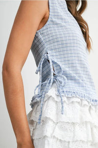 A light blue and white checkered ladder lace sleeveless blouse with tied-back detail showing the back side