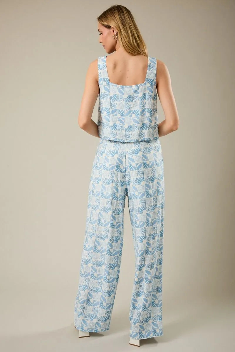 Light blue and white sleeveless square neck jumpsuit with abstract print for stylish summer wear