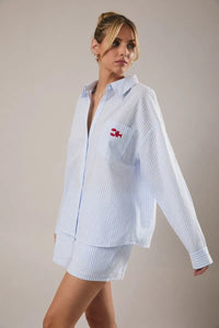 Light blue and white vertically striped oversized button-up stripe shirt with red lobster embroidery on left chest pocket