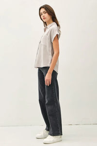 A light gray short dolman sleeve button shirt with chest pocket and relaxed fit ideal for casual wear