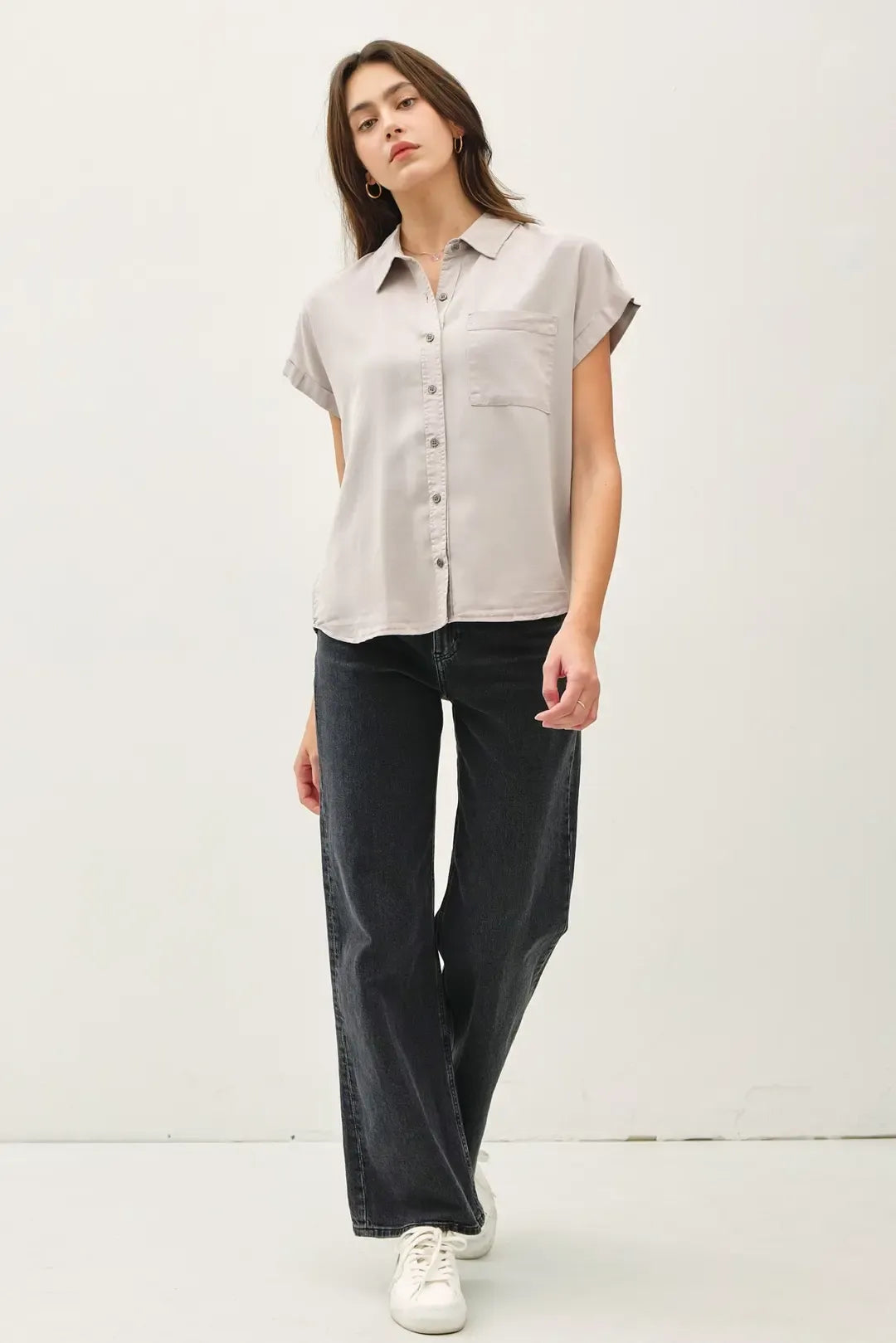 A light gray short dolman sleeve button shirt with collar and chest pocket, casual and breathable fabric