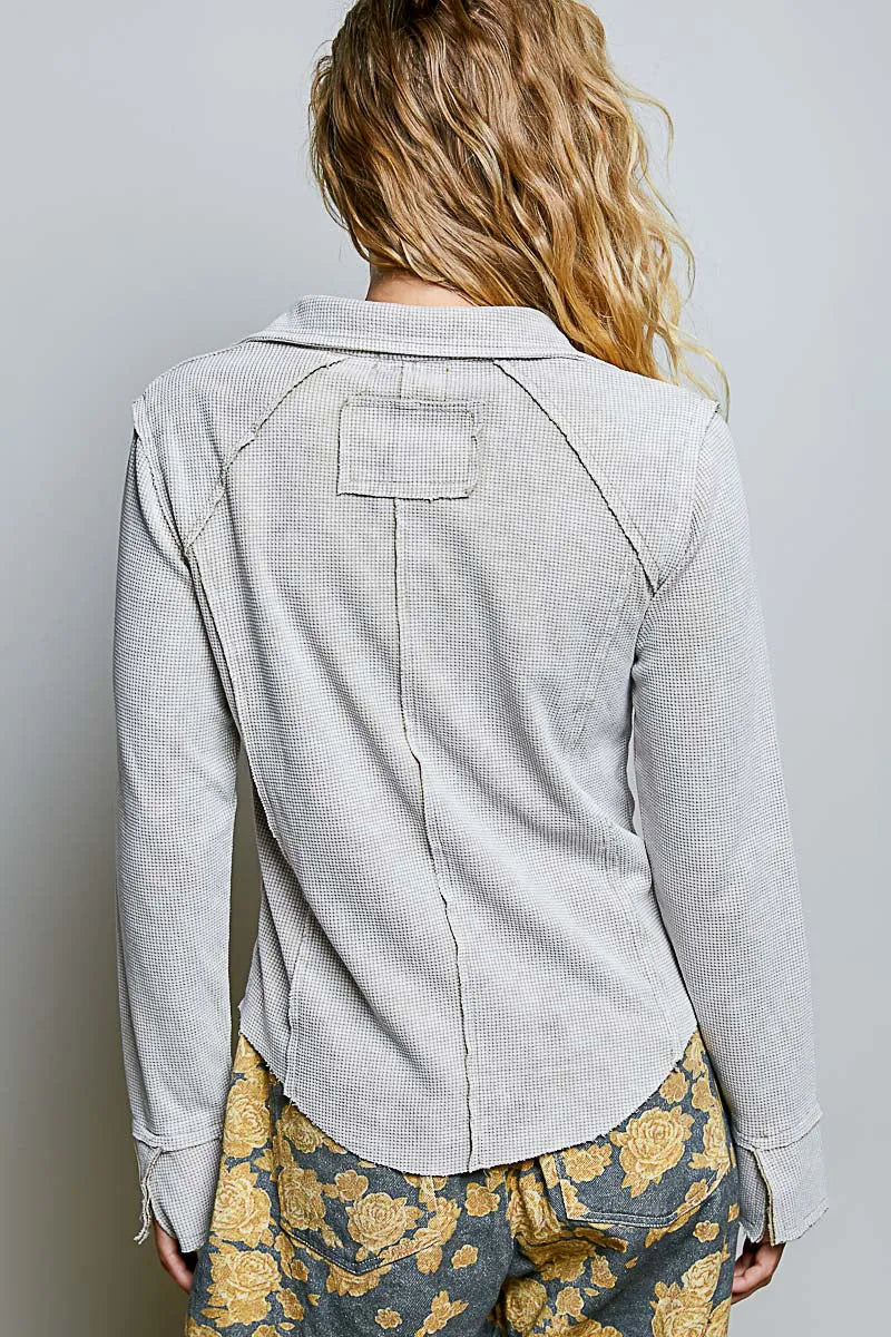 Light gray slim fit boho shirt with deep v collar neck button and patch pocket in textured fabric