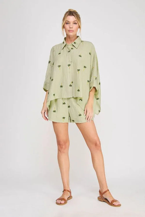 Light green palm tree crinkled woven button-up shirt with subtle palm tree print for casual wear