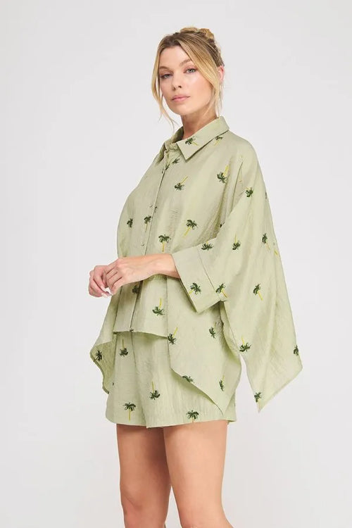 Light green palm tree crinkled woven blouse with layered design, wide sleeves, and a relaxed fit