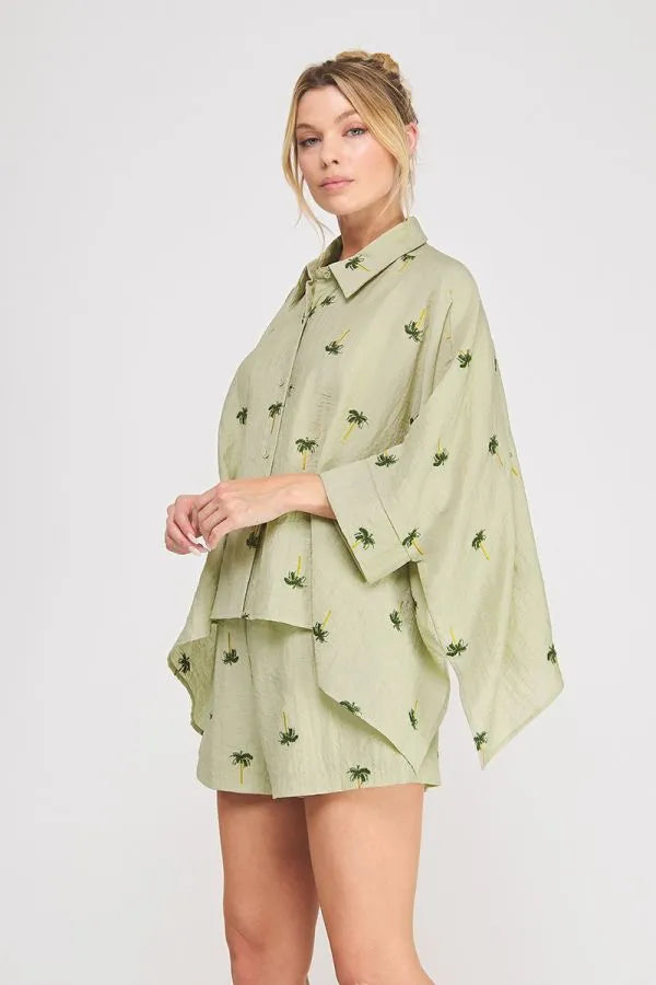Light green palm tree crinkled woven blouse with layered design, wide sleeves, and a relaxed fit