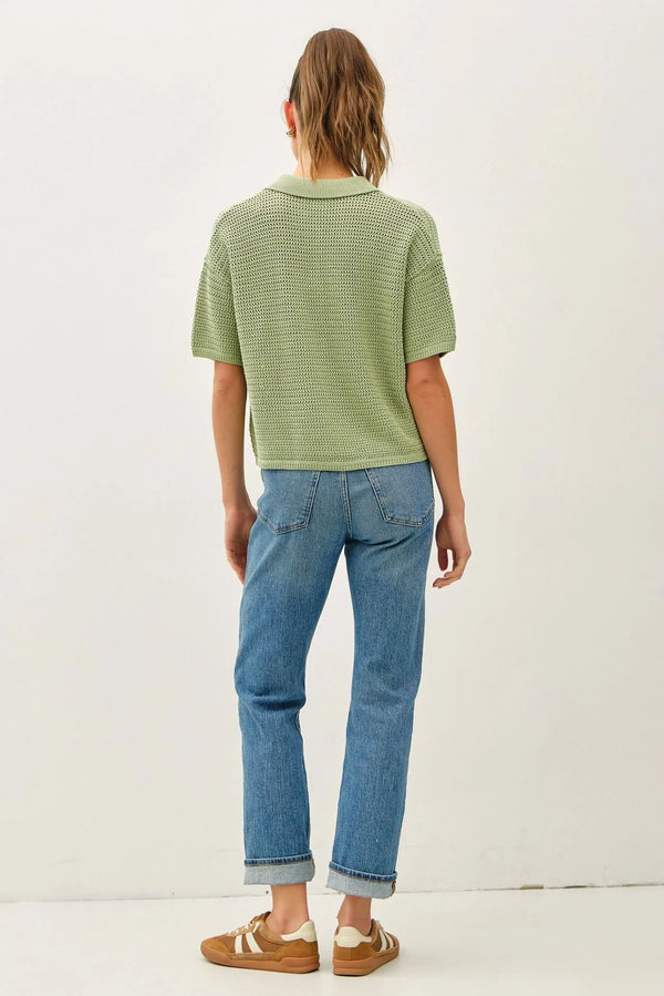 A light green boxy crochet collared short sleeve cardigan with textured knitted fabric and a polo shirt design