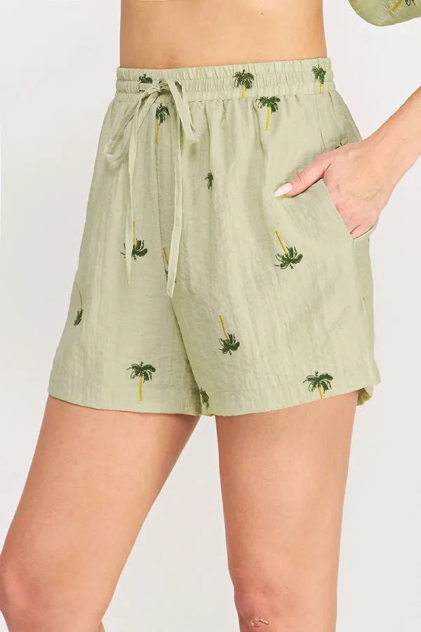 Light green palm tree crinkled woven shorts with subtle print and elastic waistband for casual wear