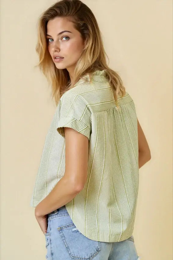 A light green and white striped gingham button down top with short sleeves and relaxed fit in size small for women’s boho chic clothing