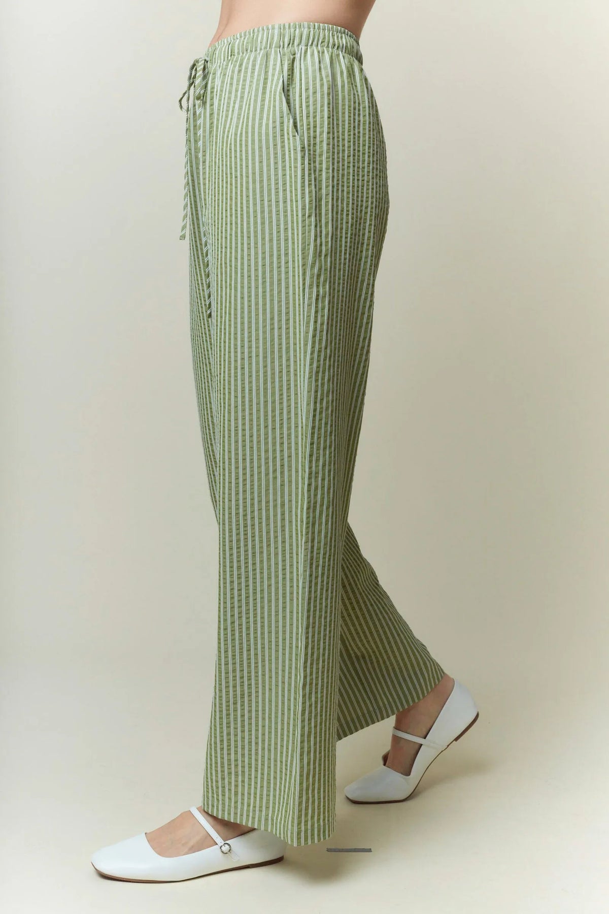Light green and white yarn dye stripe elastic pants with wide-leg cut and drawstring waistband for casual wear