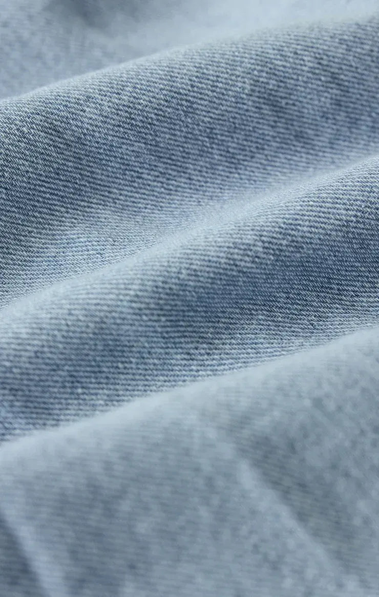 Light-wash denim fabric with soft faded blue hue and woven texture for angel eyes chambray midi dress