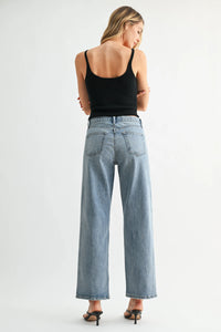 Back view of light-wash denim high-rise wide-leg jeans with classic pocket design from rise jb collection selvage jeans denim