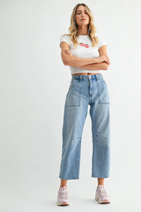 Light-wash denim mid rise utility seamed barrel jeans with wide-leg, two front patch pockets, and straight hem