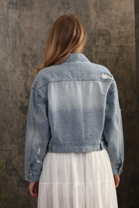 Light-wash denim jacket oversized trucker bow with distressed patches and classic collar featuring bow patch details