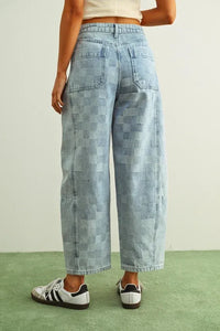 Light-wash denim checker board pattern barrel denim pants with stitched patches high-rise waist and wide-leg cut