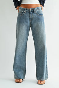 Light-wash denim jeans with low rise baggy wide leg and classic five-pocket design in casual style