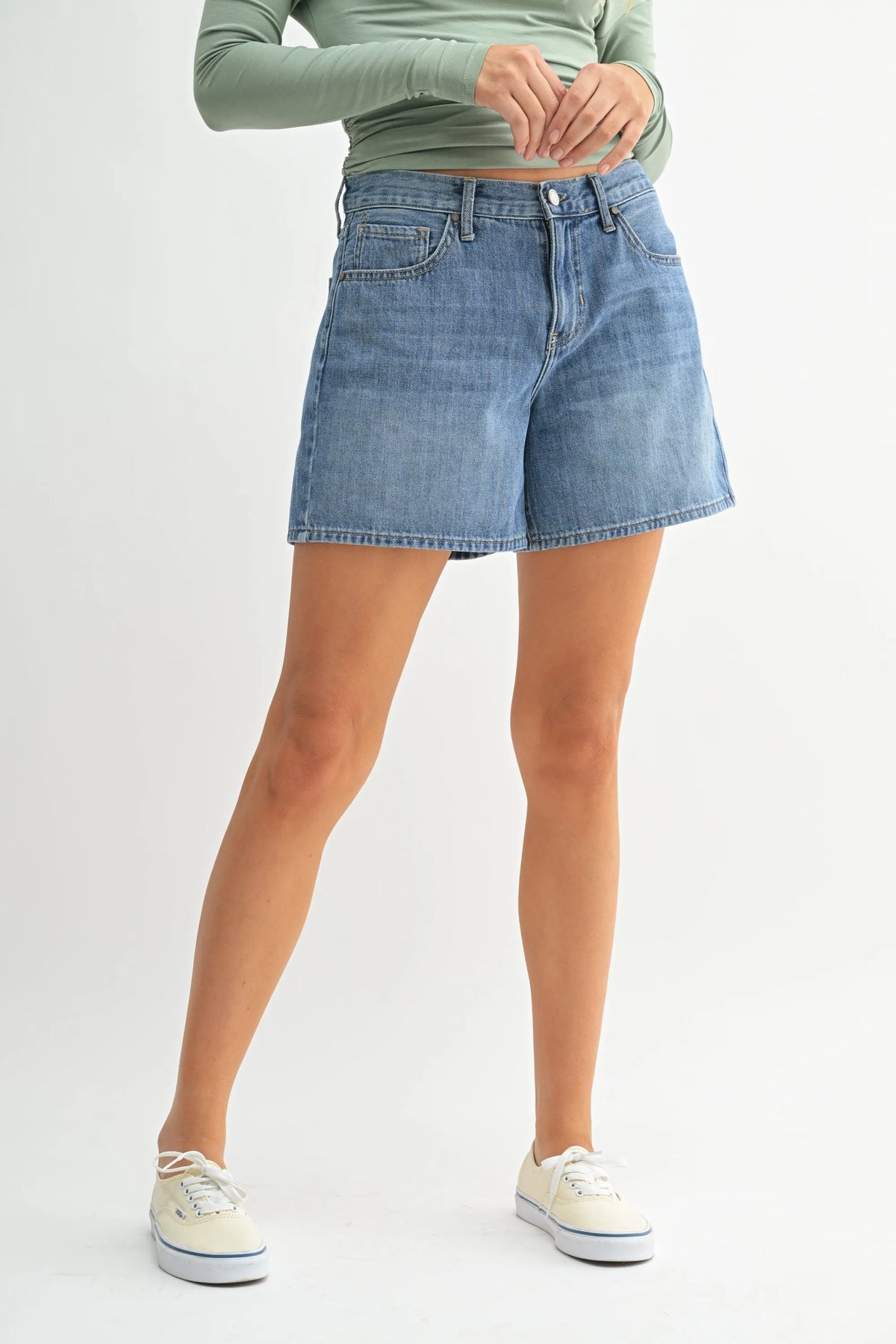 High rise lightweight light-wash denim jean shorts featuring a classic five-pocket design and button closure