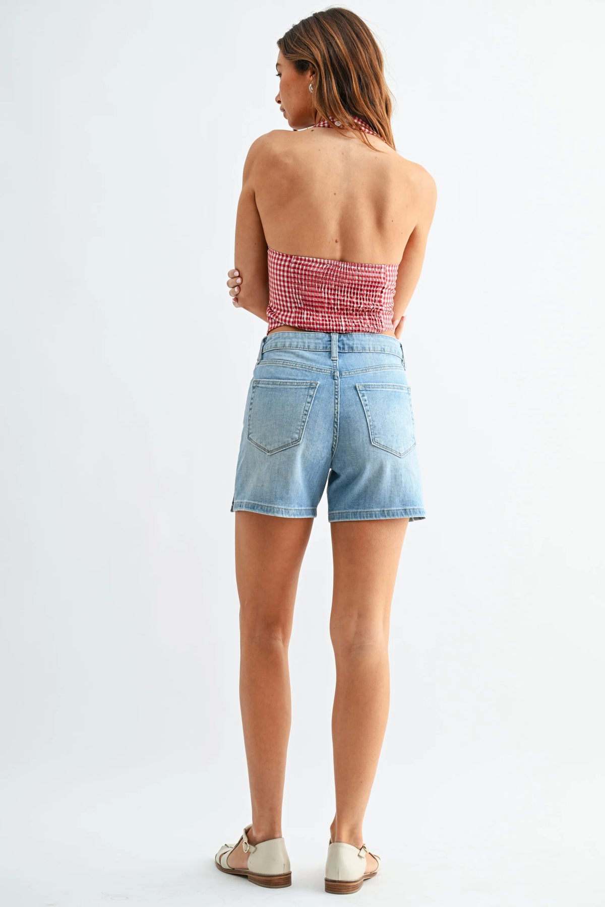 Mid rise walking denim shorts with high-rise waistband and five-pocket design