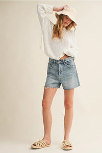 Light weight long sleeve knit top with light-wash denim shorts