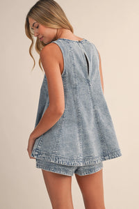 Light-wash denim longline sleeveless top with flared silhouette and back zipper detail shown from the back side