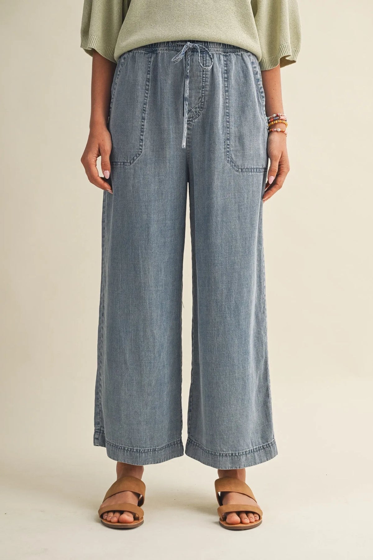 Light-wash denim drawstring waist patch pocket wide leg pants with two front pockets for casual wear