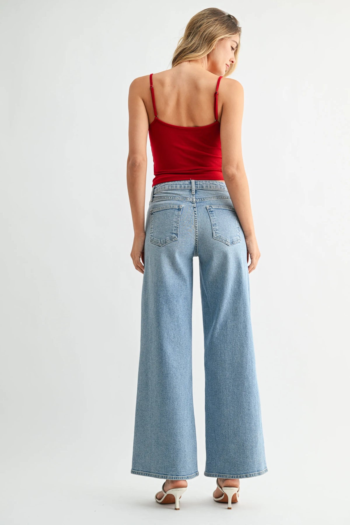 High-rise ultra wide-leg light-wash denim jeans back view