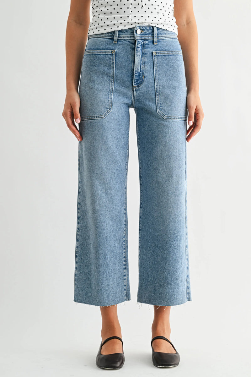 Nautical high rise wide leg denim jeans in light-wash with frayed hem and classic front pockets for nautical denim style