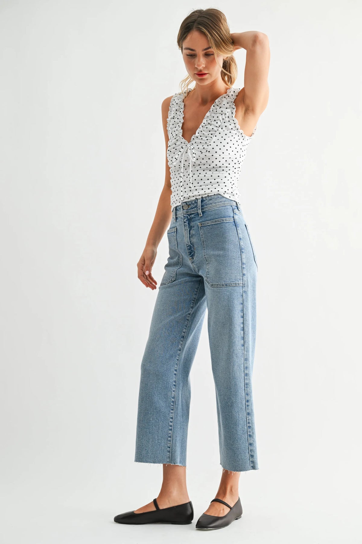 Light-wash nautical high rise wide leg denim jeans with frayed hems and a cropped straight leg cut
