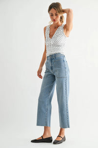 Light-wash nautical high rise wide leg denim jeans with frayed hems and a cropped straight leg cut