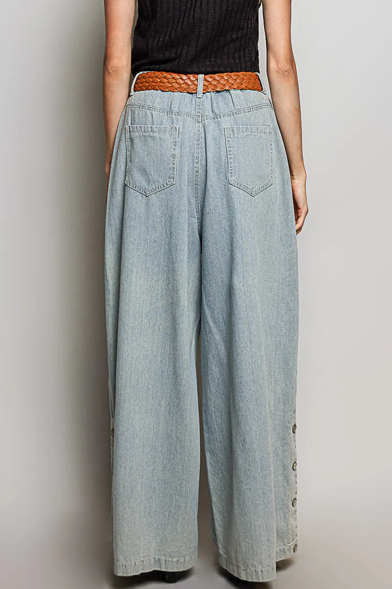 Light-wash relaxed fit pointed denim wide-leg pants with button side details and braided brown belt for women’s boho chic clothing