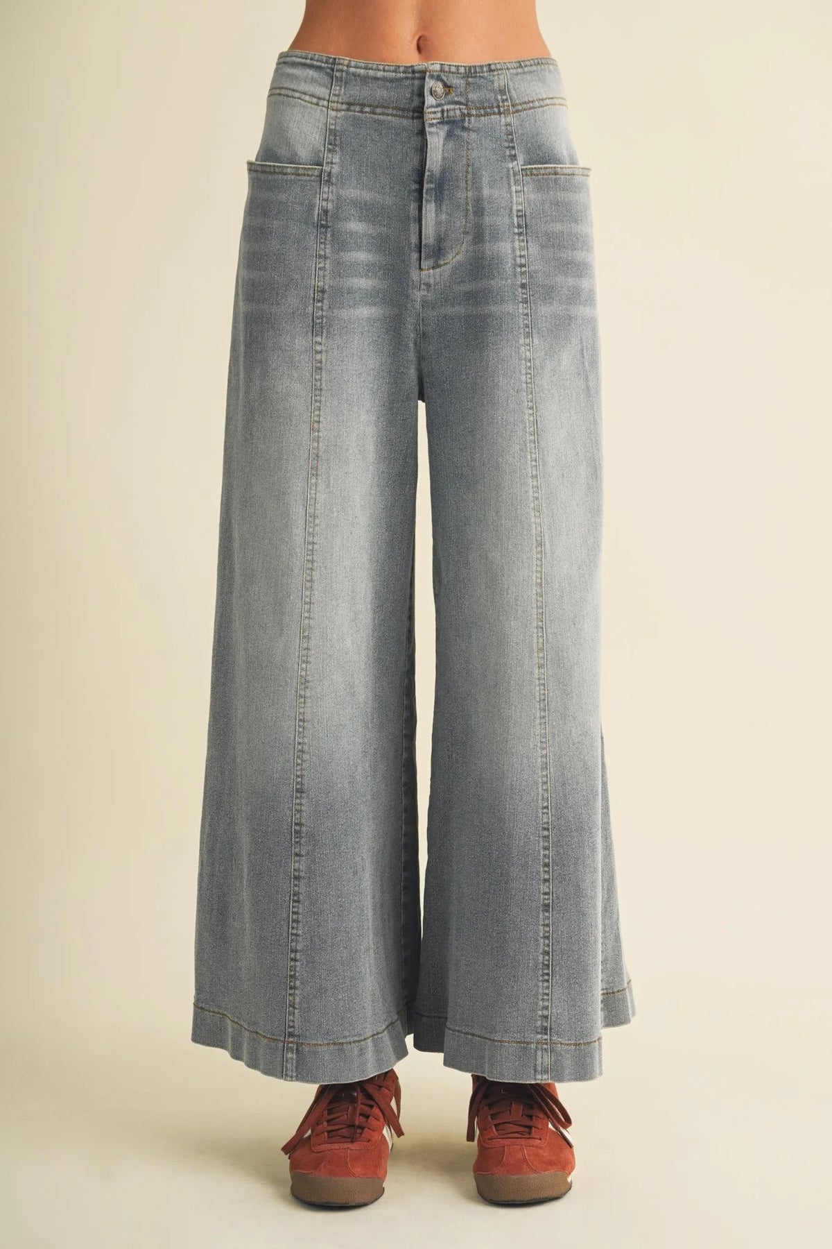 Light-wash vertical seam wide denim high-waist wide leg pants with visible stitching details