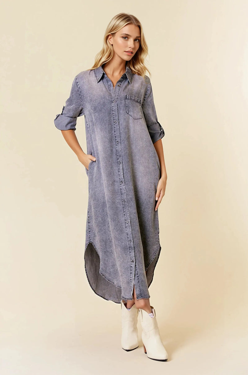 A long faded blue button-front midi dress with rolled sleeve tencel denim fabric and roll tab 3/4 sleeves