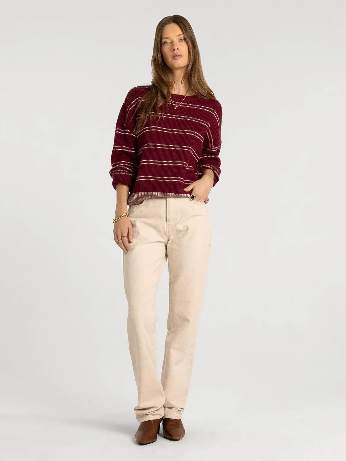 A maroon and cream striped knit supply ely sweater with relaxed fit ribbed cuffs and hem in thread and supply