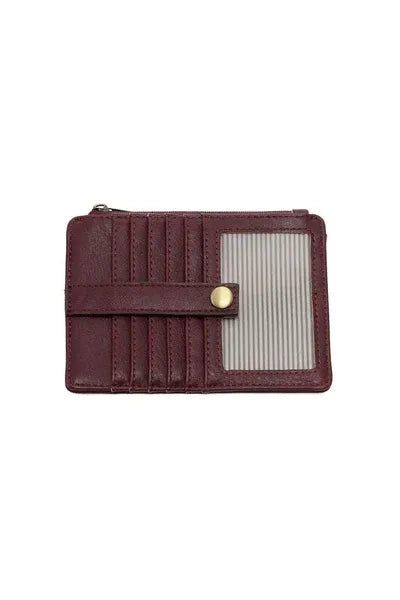 A maroon leather penny mini travel wallet with gold-tone snap closure and vertical card slots for organized storage