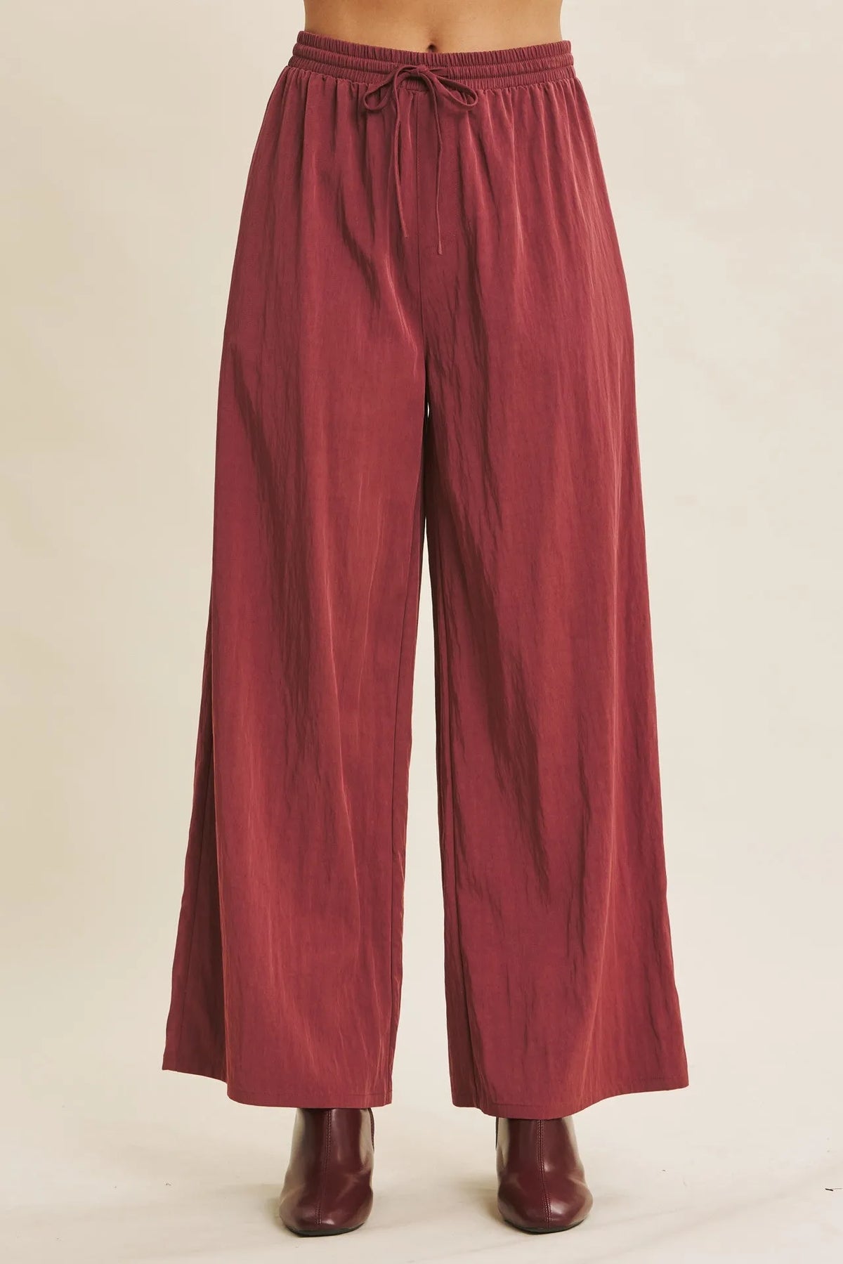 Maroon step washed wide leg pants with elastic waistband and drawstring for comfortable casual wear