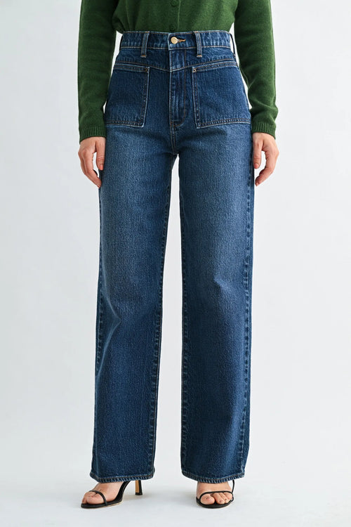 Mid rise square patch pocket straight denim jeans in medium blue wash with high waist wide-leg design and visible stitching