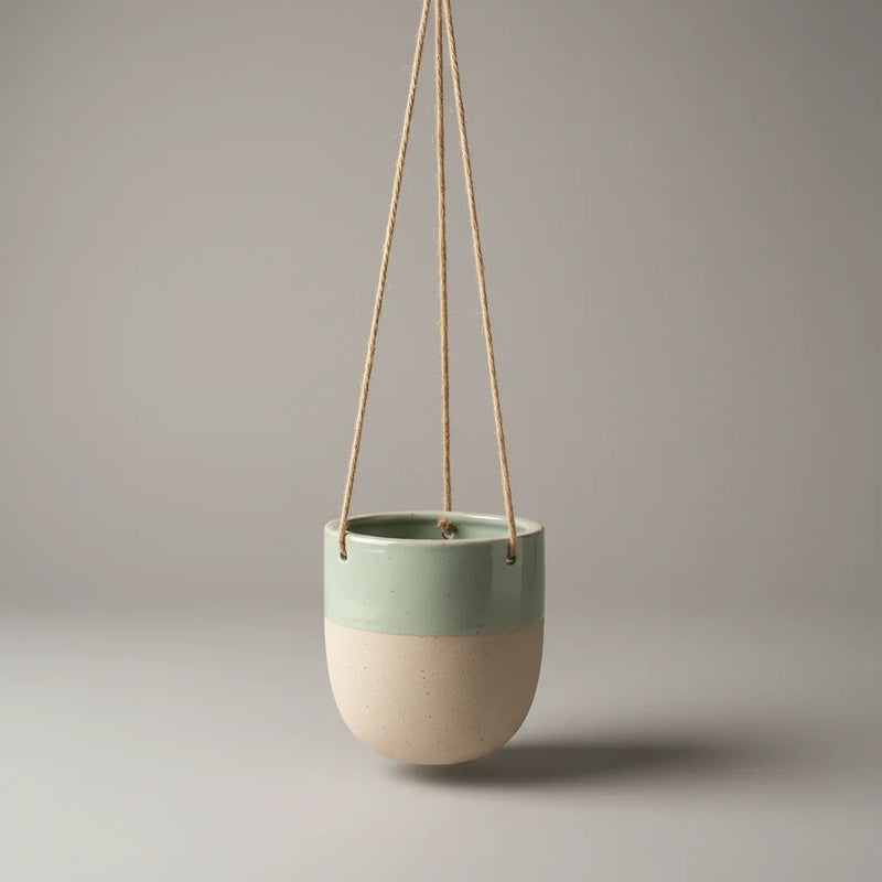 Boho sage green glazed ceramic hanging planter with mint and off-white tones