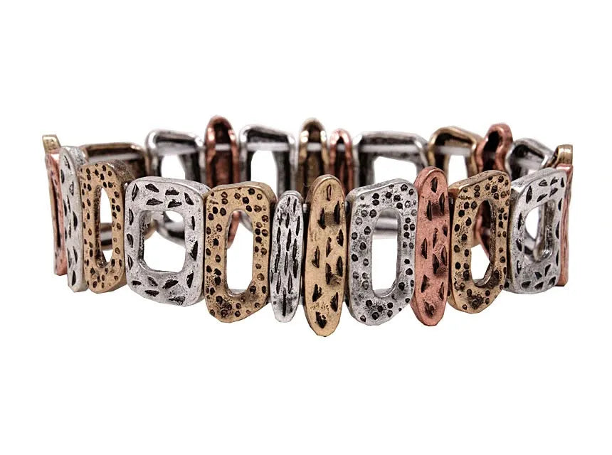 Elegant artisanal multi-metal textured stretch statement bracelet in silver rose gold and bronze with perforated design