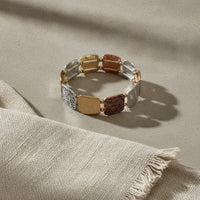 Bohemian mixed metal stretch bracelet with gold rose gold and silver engraved rectangular links in a metal stretch design