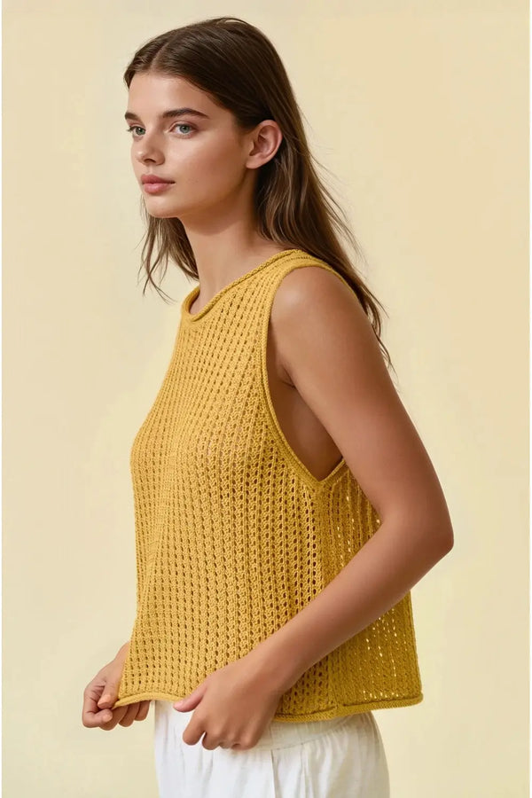 A mustard-yellow open stitch sweater sleeveless tank top with round neck and cut-out shoulder details