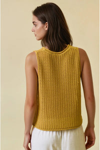 A mustard-yellow sleeveless open stitch sweater round neck tank top with a textured ribbed pattern