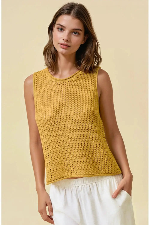 A mustard-yellow open stitch sweater sleeveless tank top with a round neck and knitted openwork texture