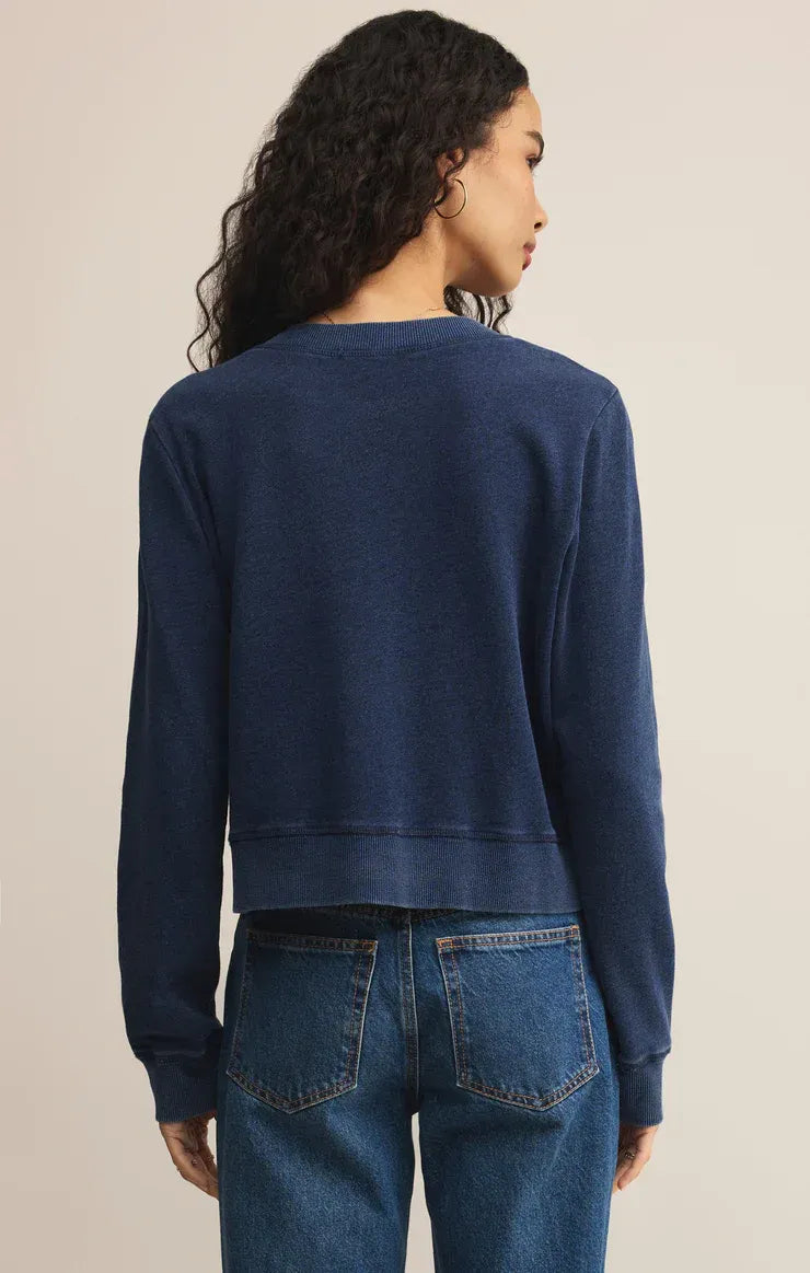Navy blue daily knit denim cardigan with ribbed cuffs and hem in a cropped sweater style