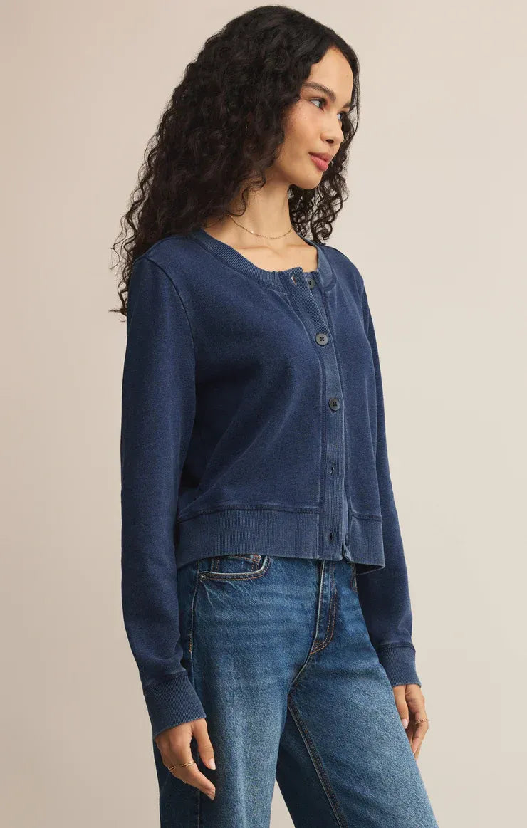 A navy blue daily knit denim cardigan with a relaxed fit, button front closure, and ribbed cuffs