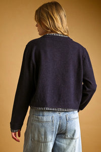 Navy blue cropped knit cardigan with plaid contrasted button front featuring checkered collar and hem detail