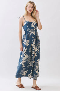 Navy blue floral cami midi dress with delicate white blossoms thin spaghetti straps and gathered waist details