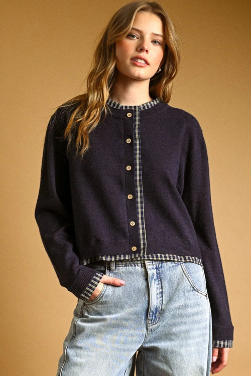 Navy blue knit cardigan with plaid contrasted button front trim and gold buttons for stylish layering