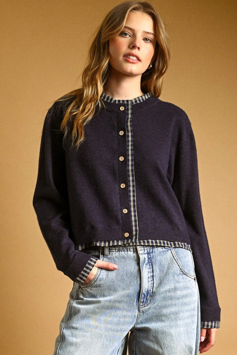 Navy blue knit cardigan with plaid contrasted button front trim and gold buttons for stylish layering