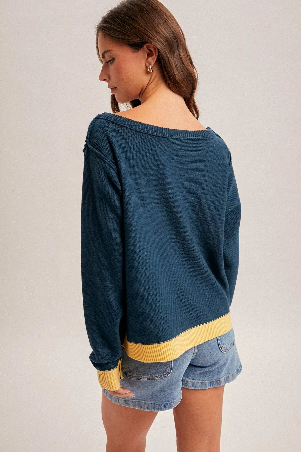 Summer night graphic sweater in navy blue with yellow ribbed trim