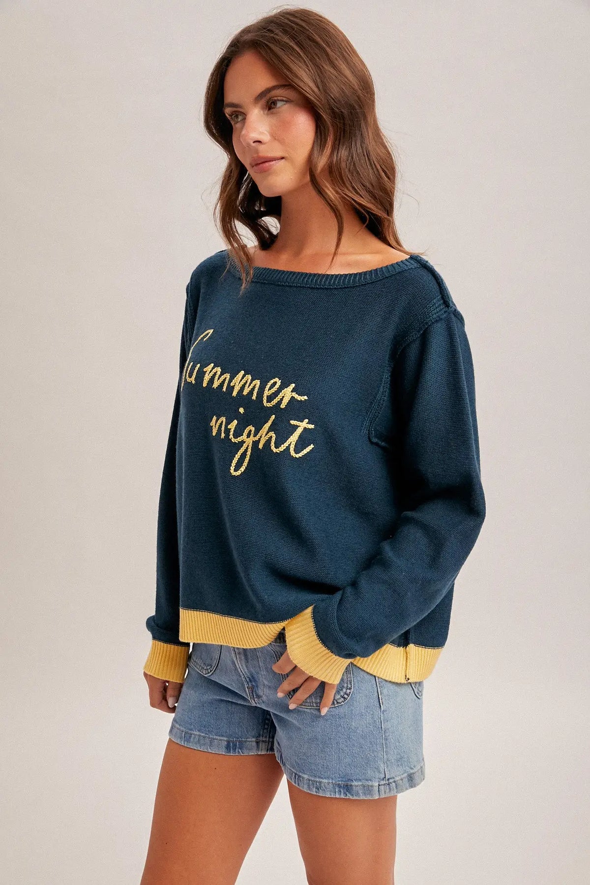 Summer night graphic sweater in navy blue with gold lettering